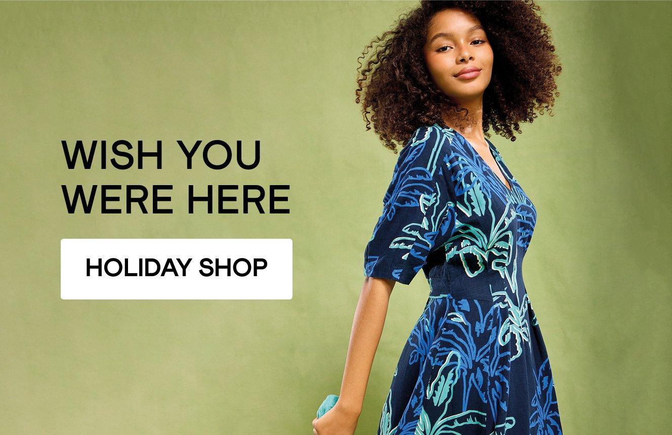a woman wearing a dress, click here to shop holiday clothing
