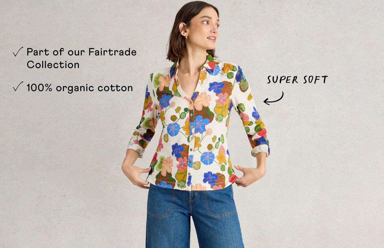 A woman wearing a shirt with a floral print. Annotations on the image call out the shirt is "super soft, 100% organic cotton and part of our Fairtrade Collection".