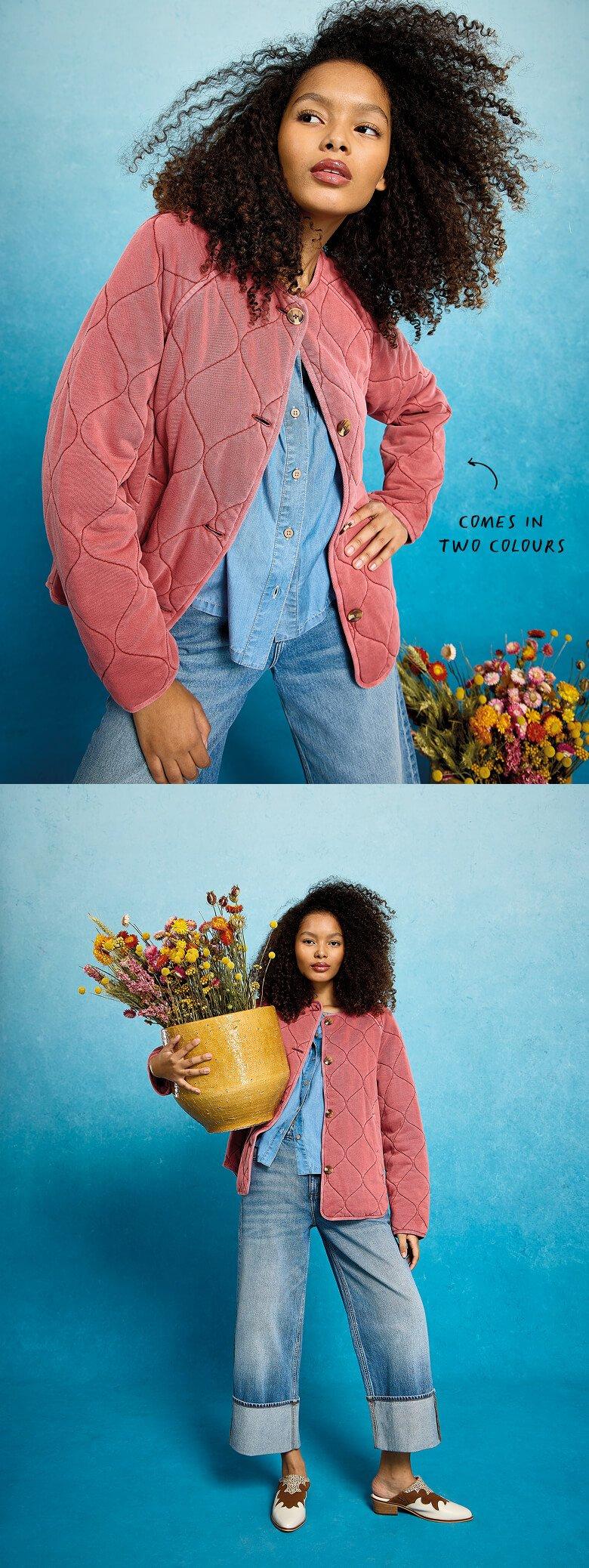 a woman in a dress and jacket is posing for a photo