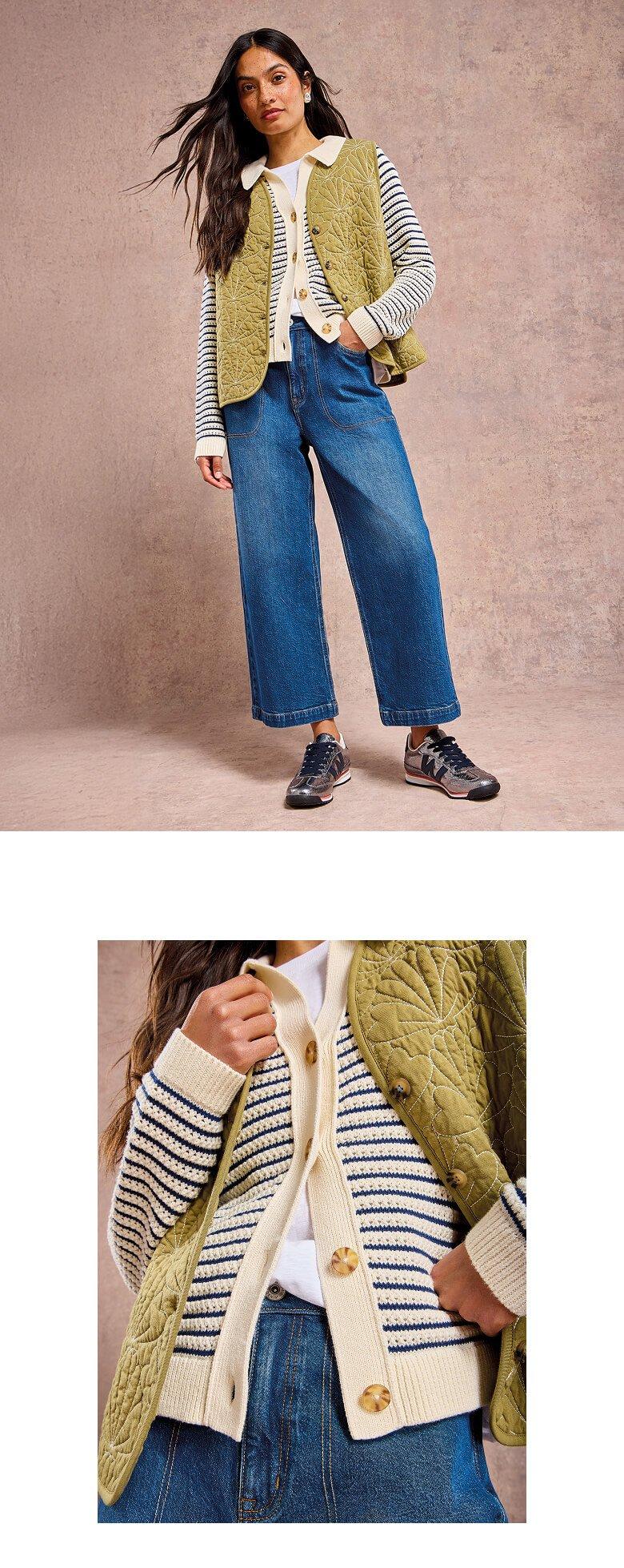 the model is wearing a striped sweater and jeans