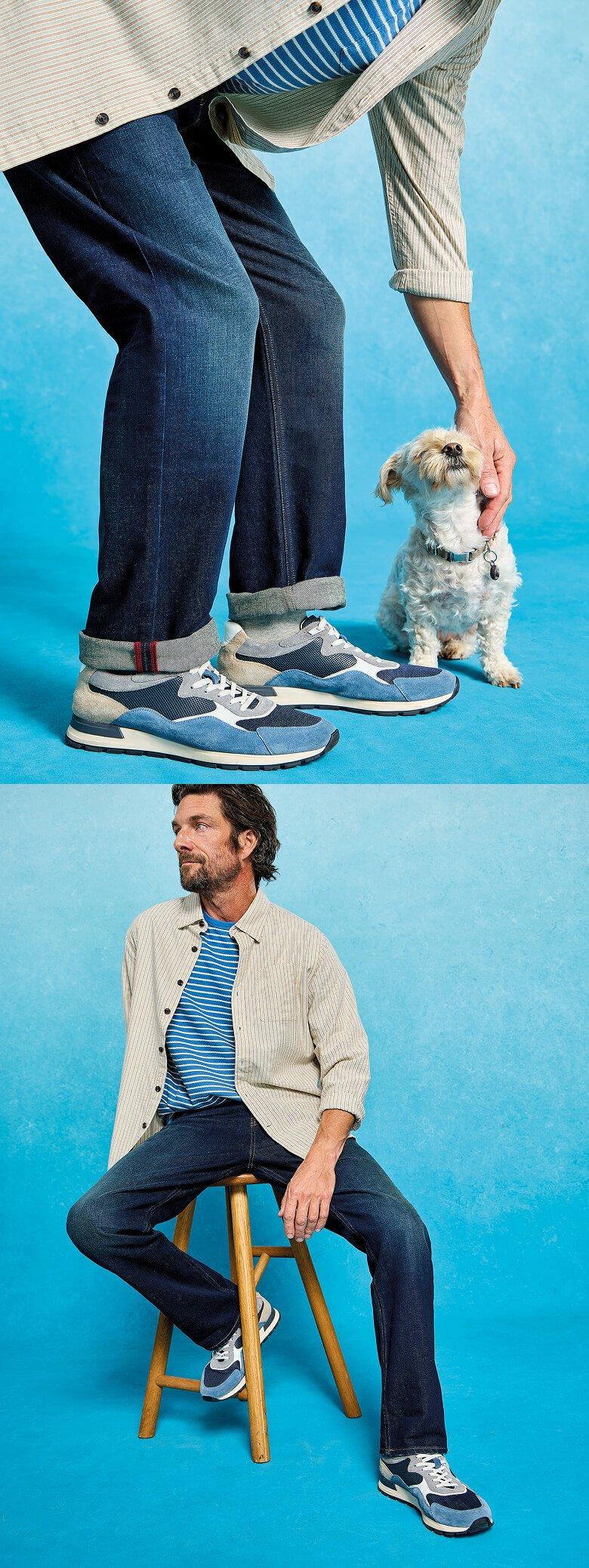 a man sitting on a stool with a dog