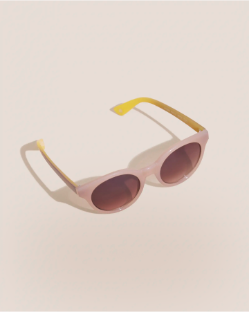 a pair of sunglasses with a pink frame and yellow lenses