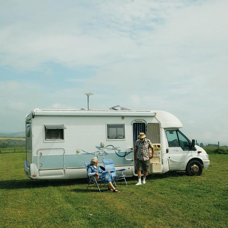 couple in front of their van