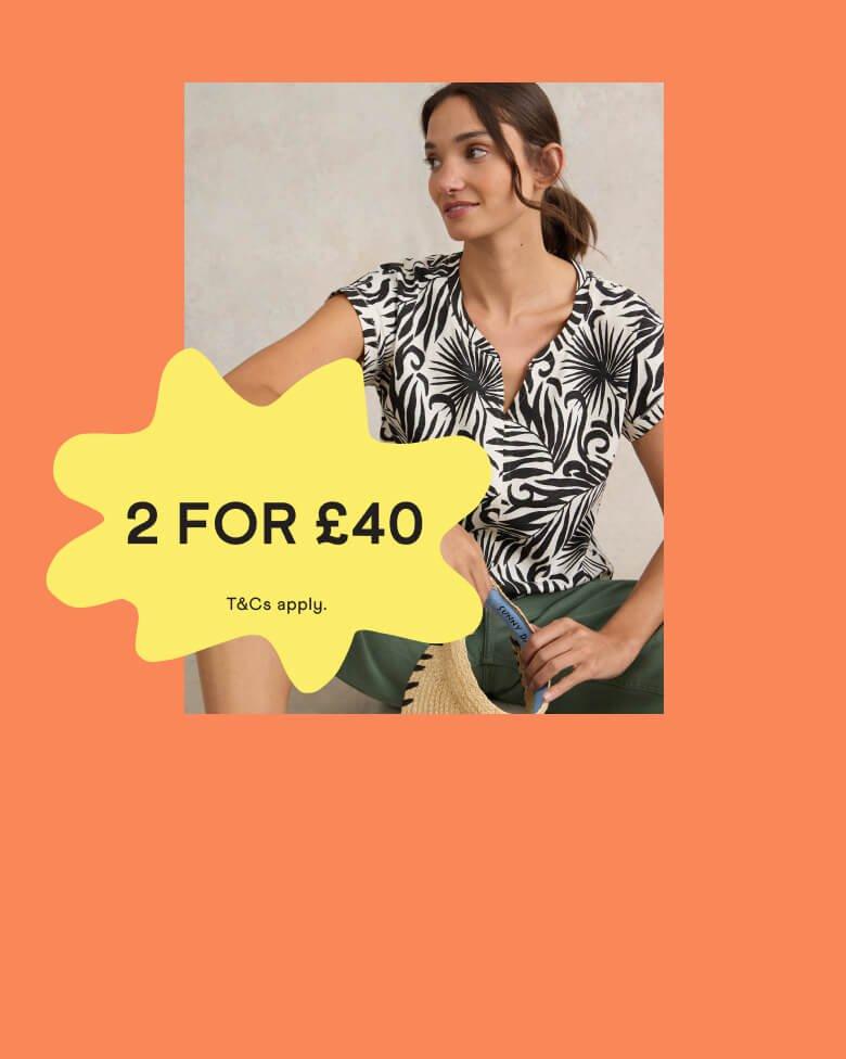 Woman in a black and white t-shirt with a '2 for £40' promotional banner