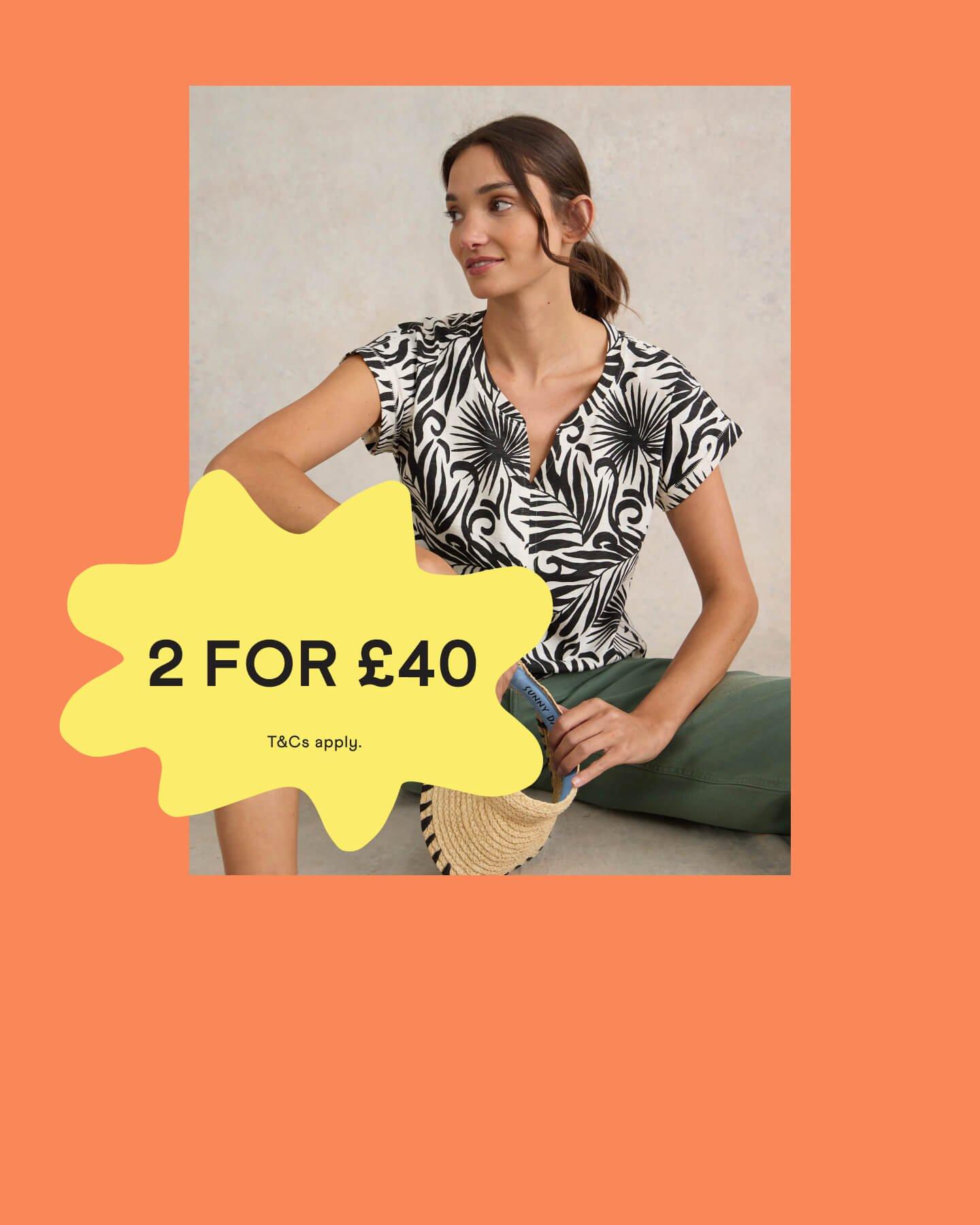 Woman in a black and white t-shirt with a '2 for £40' promotional banner
