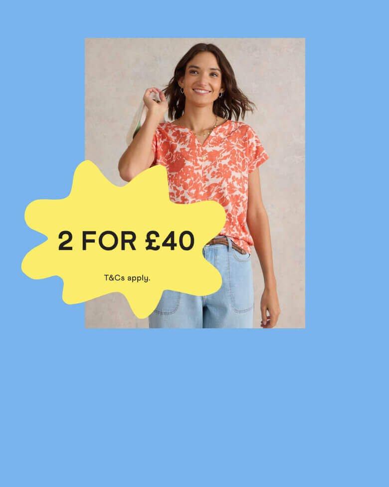 Woman in a orange and white t-shirt with a '2 for £40' promotional banner