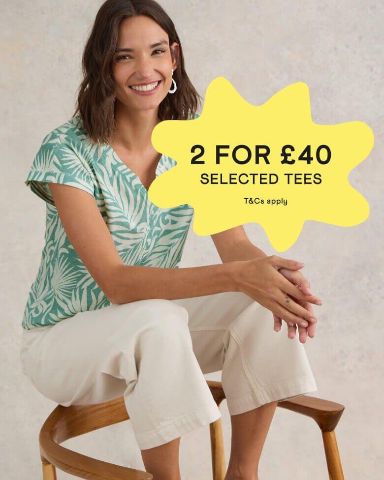 Woman in a green and white t-shirt with a '2 for £40' on selected Tees promotional banner